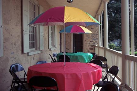 tables with umbrellas beach theme props